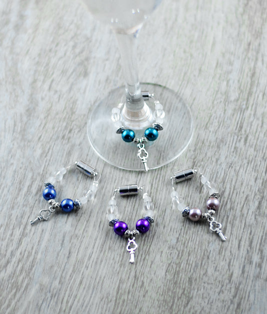 4er Set Schmuckes Glas / Sektglasmarkierer / Weinglasmarkierer / Glasmarker blau, lila, altrosé, petrolgrün