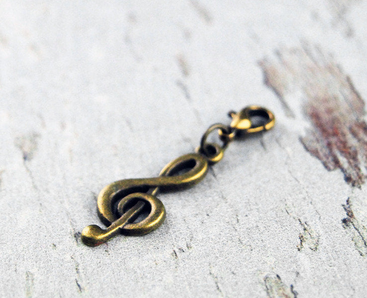 Charm "Notenschlüssel" Bronze