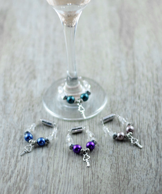 4er Set Schmuckes Glas / Sektglasmarkierer / Weinglasmarkierer / Glasmarker blau, lila, altrosé, petrolgrün