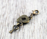 Charm "Schlüssel zum Herzen" Bronze
