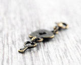 Charm "Schlüssel zum Herzen" Bronze
