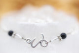 Armschmuck Steinbock versilbert mit Bergkristall und Onyx - Sternzeichen Schmuck